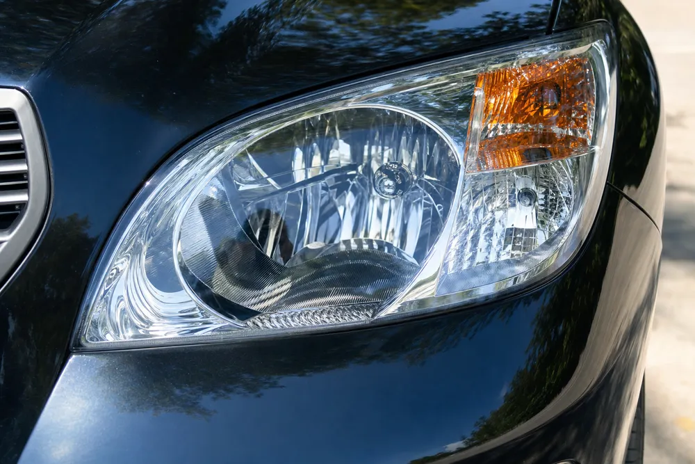 Restored headlight lens, clear and glossy